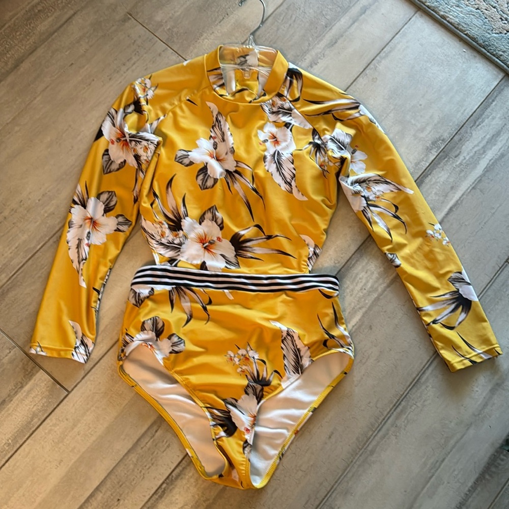 One piece open back size Large , padded. Can be removed .